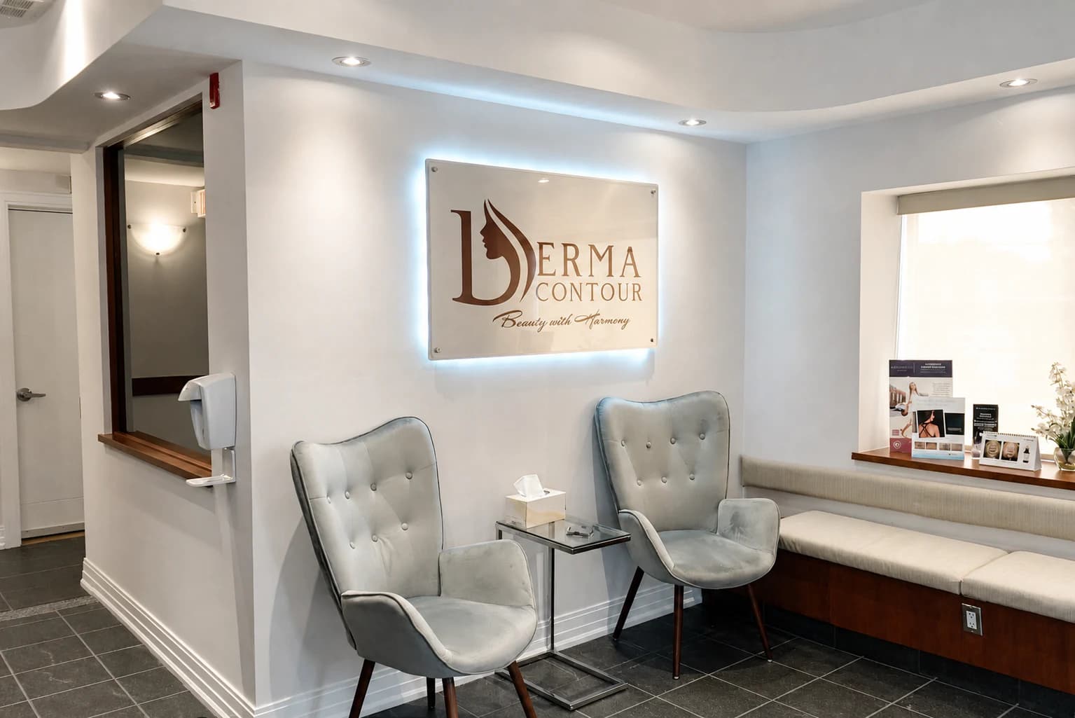 Derma Contour Ottawa clinic lounge with illuminated logo wall